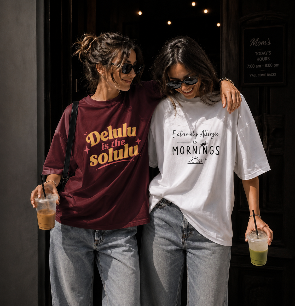 Two people wearing t-shirts with humorous text designs, standing close together.
