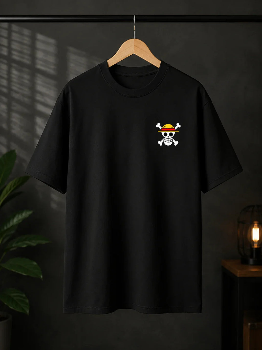Black anime streetwear tee with skull and straw hat graphic, bold design for fans