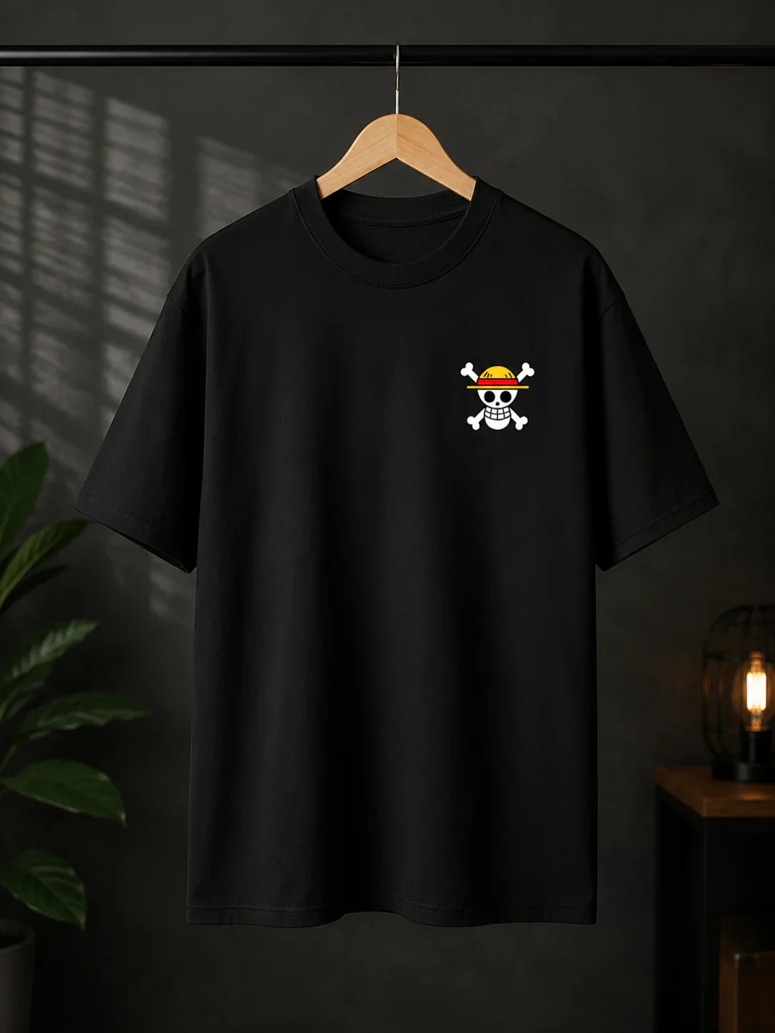 Black anime streetwear tee with skull and straw hat graphic, bold design for fans