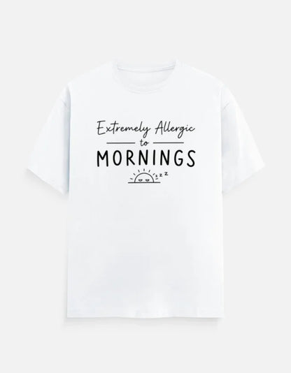 White graphic tee with 'Extremely Allergic to Mornings' text and sleepy sun design, bold streetwear style