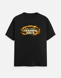 Black streetwear tee with 'Built Through Training Arcs' in fiery gold design, bold gym-inspired graphic.