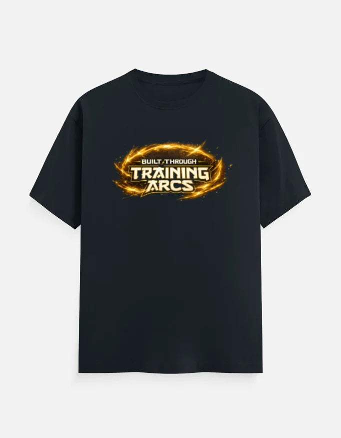 Black streetwear tee with 'Built Through Training Arcs' graphic in fiery gold, bold gym-inspired design