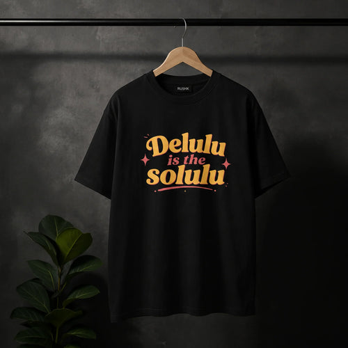 Black streetwear tee with 'Delulu is the Solulu' graphic, bold retro design, hanging on wood hanger