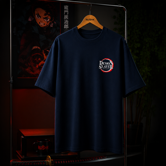 Navy blue t-shirt with Demon Slayer logo on a hanger against a dark background