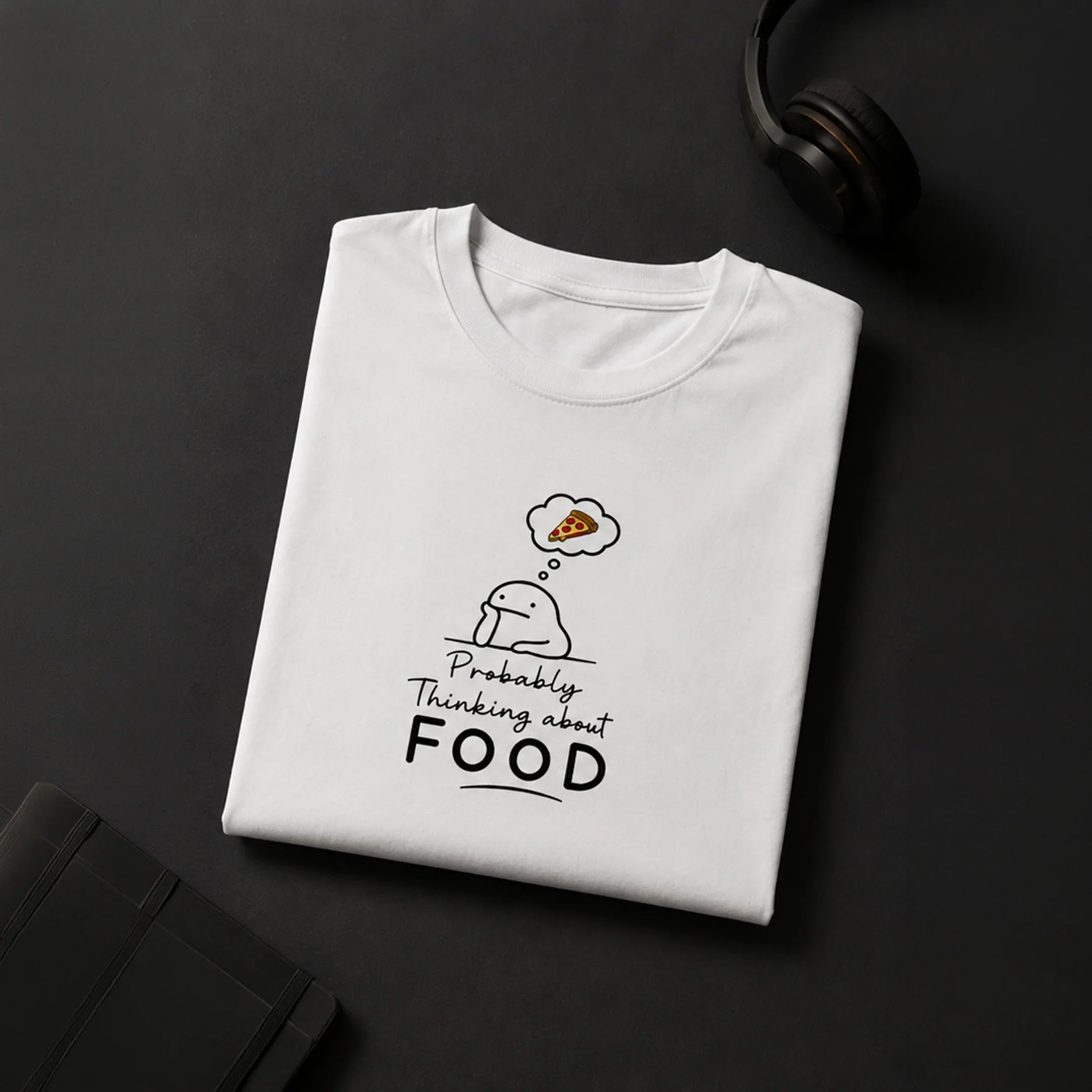 White graphic tee with cute character thinking about pizza, bold 'Probably Thinking about FOOD' text, streetwear style