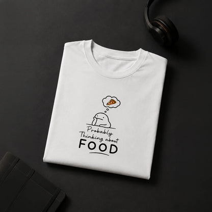 White graphic tee with cute character thinking about pizza, bold 'Probably Thinking about FOOD' text, streetwear style